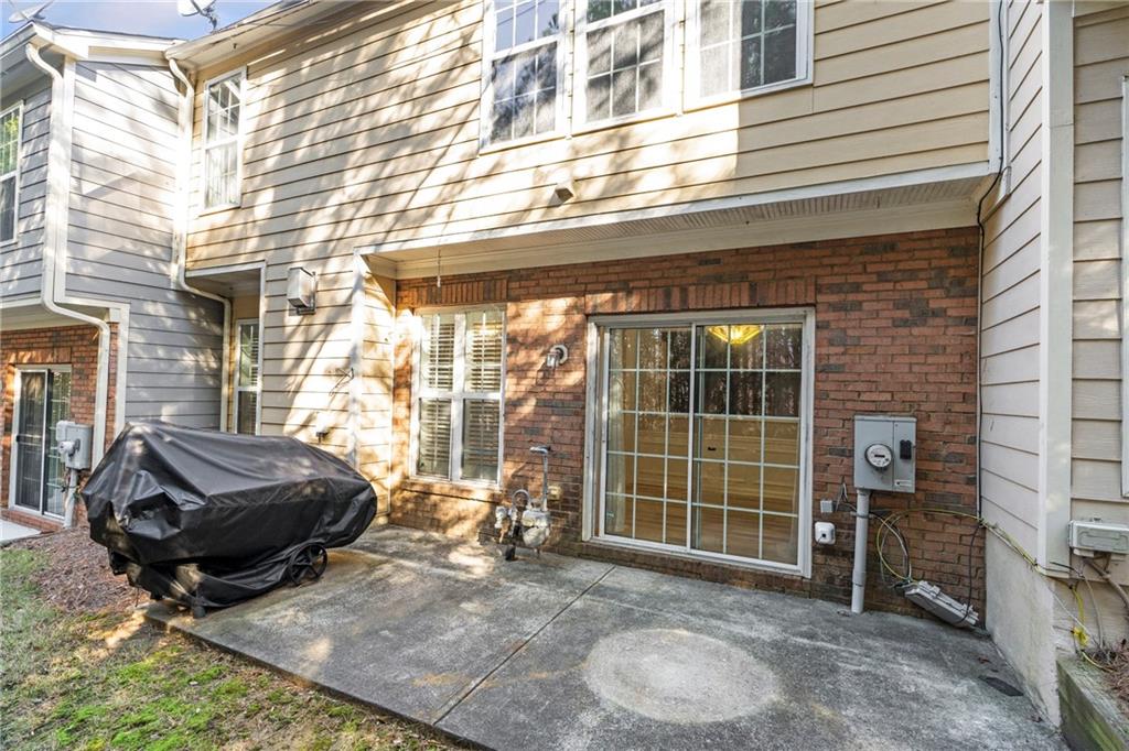 1653 Fair Oak Way Mableton, GA 30126 - Photo 27 of 30 a view of a backyard with table and chairs