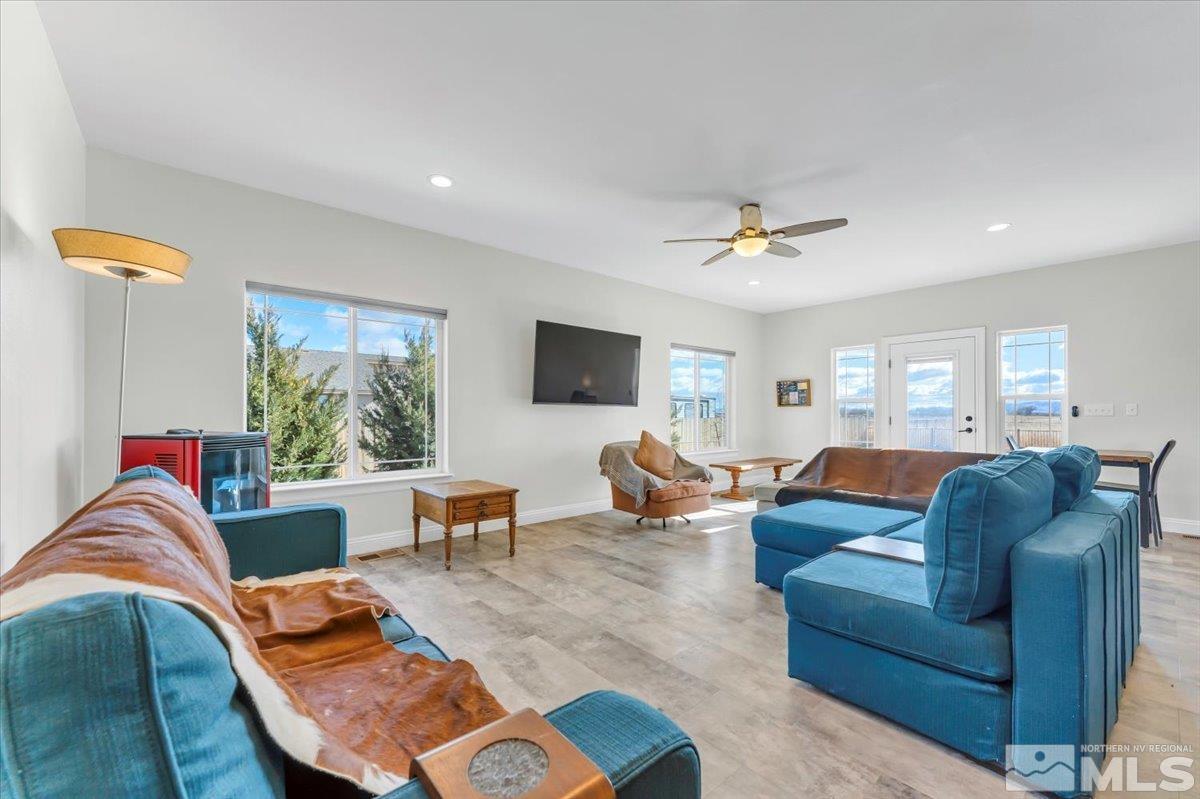 3071 Schindler Road Fallon, NV 89406 - Photo 8 of 40 a living room with furniture ceiling fan and a window