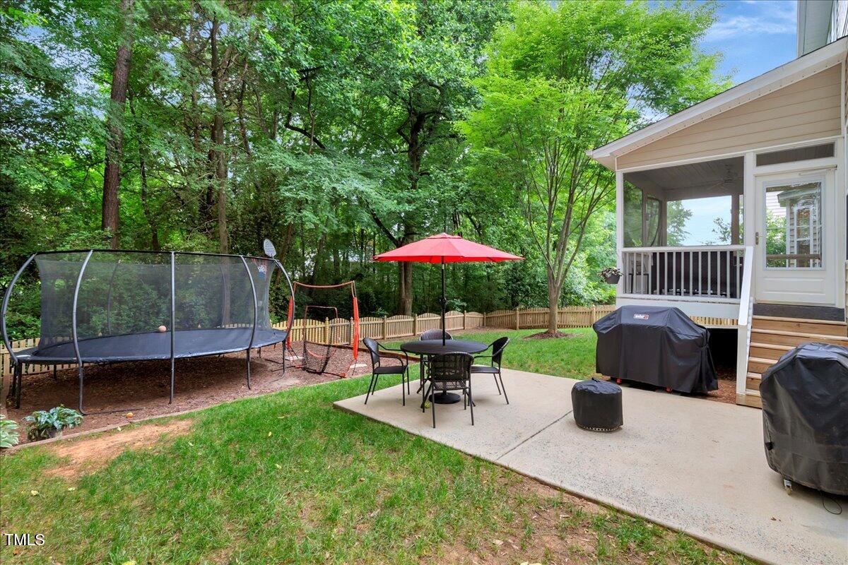 201 Forbes Road Wake Forest, NC 27587 - Photo 10 of 42 a view of a chair and table in the patio