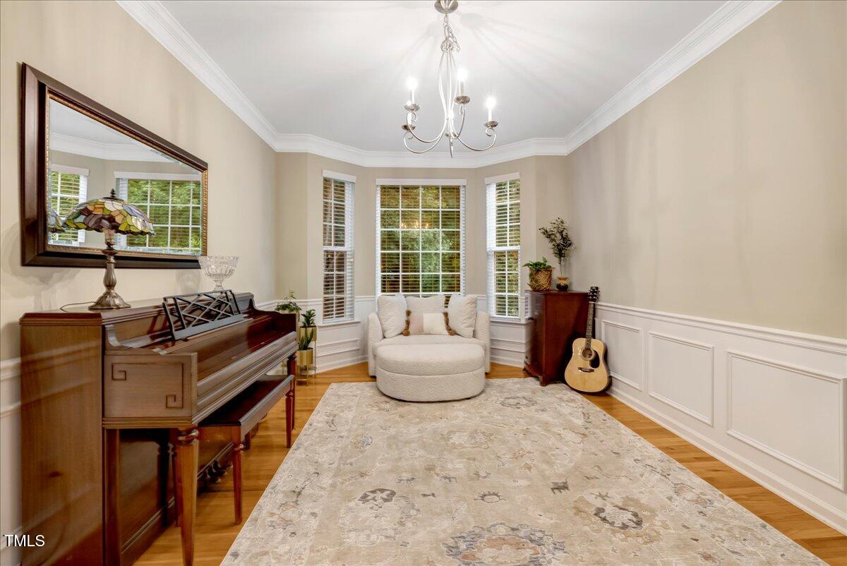 201 Forbes Road Wake Forest, NC 27587 - Photo 16 of 42 a bedroom with furniture and a large window