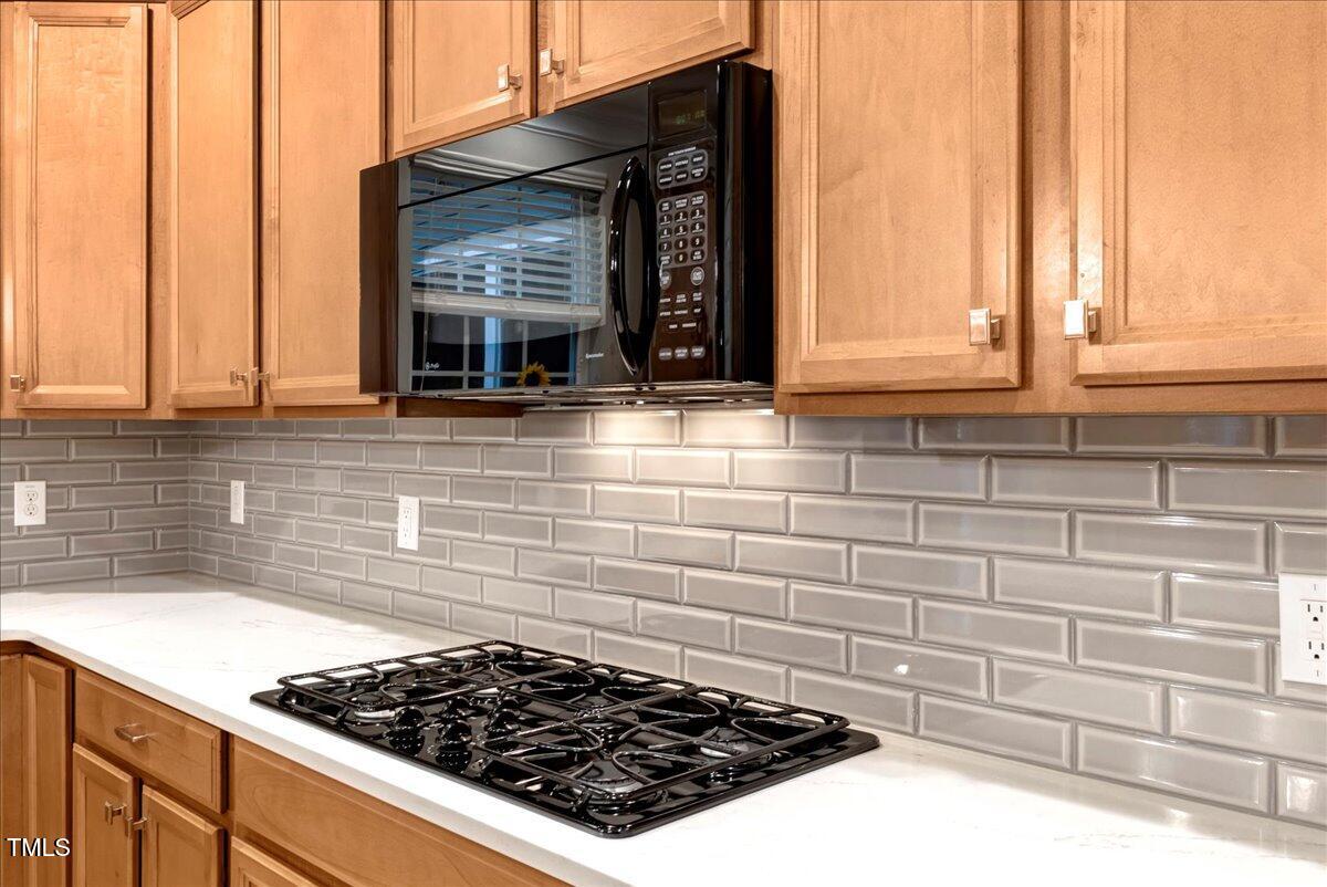201 Forbes Road Wake Forest, NC 27587 - Photo 20 of 42 a kitchen with a stove and a window