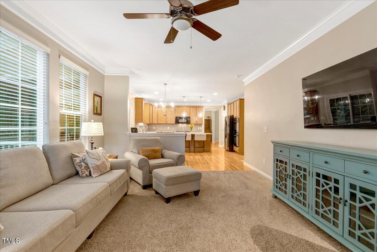 201 Forbes Road Wake Forest, NC 27587 - Photo 24 of 42 a living room with furniture and a large window