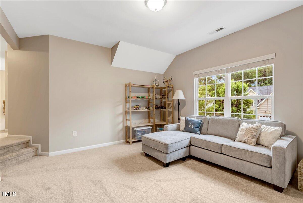 201 Forbes Road Wake Forest, NC 27587 - Photo 29 of 42 a living room with furniture and a large window