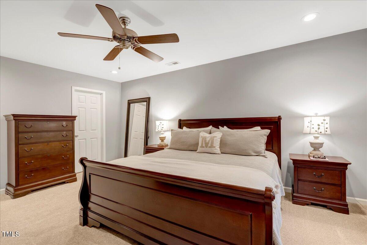 201 Forbes Road Wake Forest, NC 27587 - Photo 32 of 42 a bedroom with a bed and a dresser