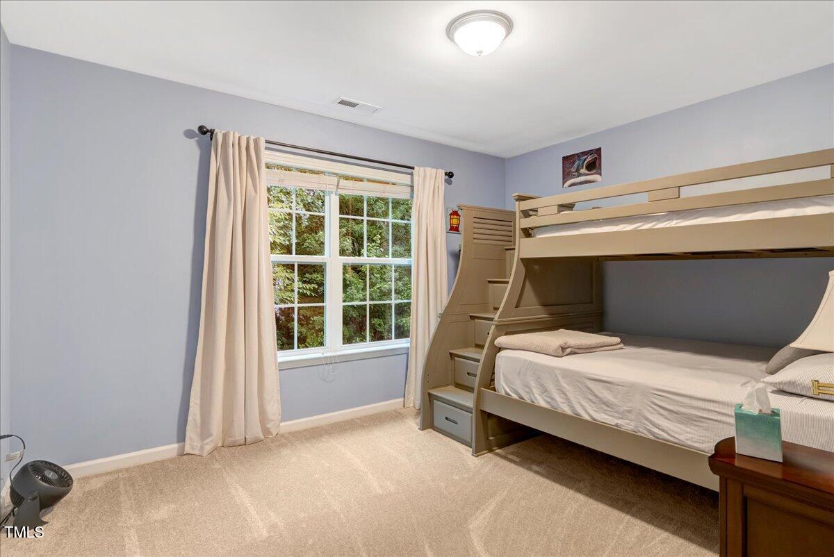 201 Forbes Road Wake Forest, NC 27587 - Photo 37 of 42 a bedroom with a bed and a window