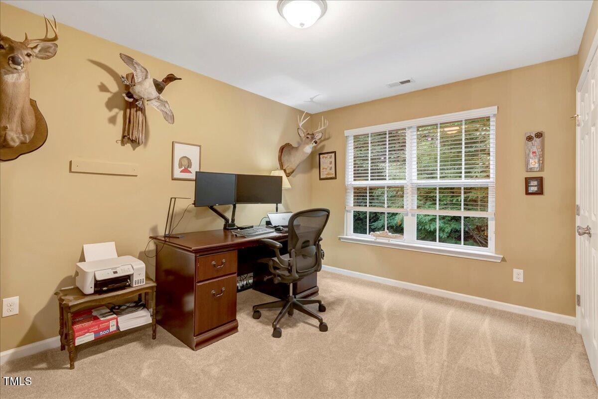 201 Forbes Road Wake Forest, NC 27587 - Photo 38 of 42 a workspace with furniture and a window