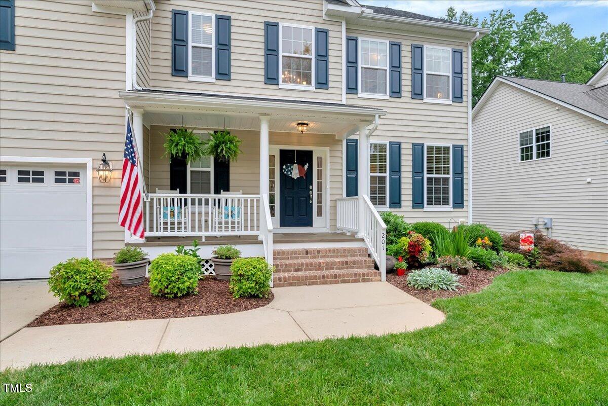 201 Forbes Road Wake Forest, NC 27587 - Photo 4 of 42 a front view of a house with garden