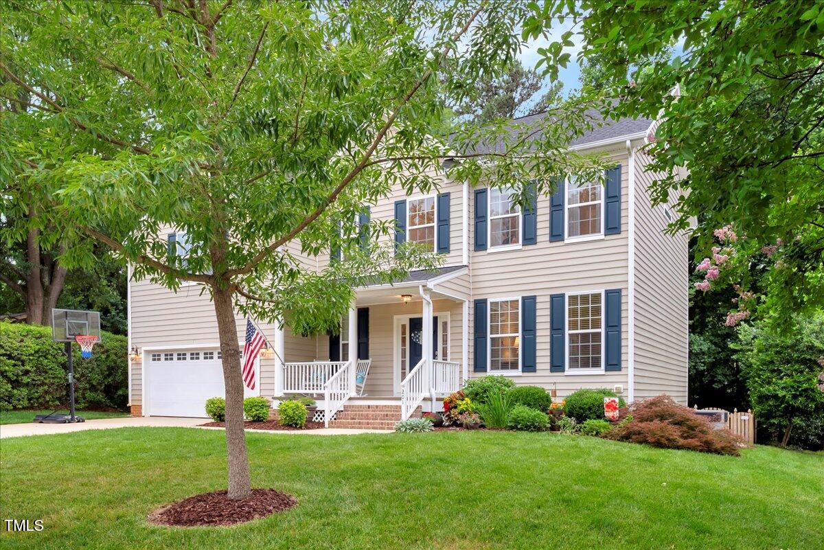201 Forbes Road Wake Forest, NC 27587 - Photo 7 of 42 a front view of a house with a garden and trees