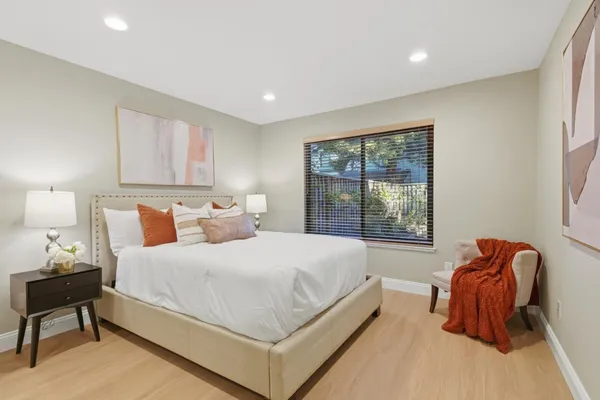 a bedroom with a bed and a window