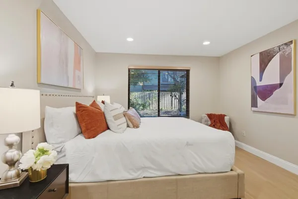 a bedroom with a bed and a window