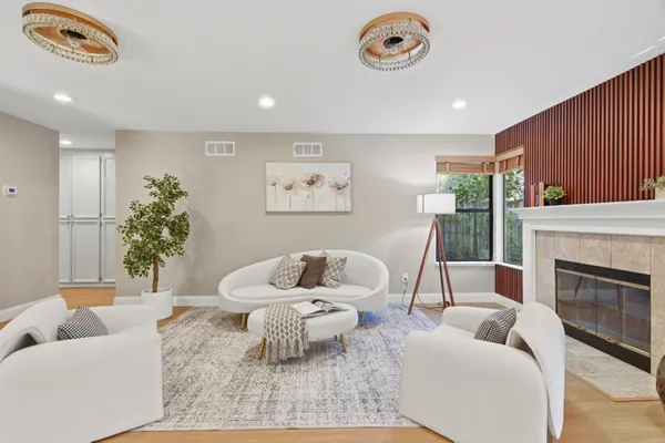 a living room with furniture and a fireplace