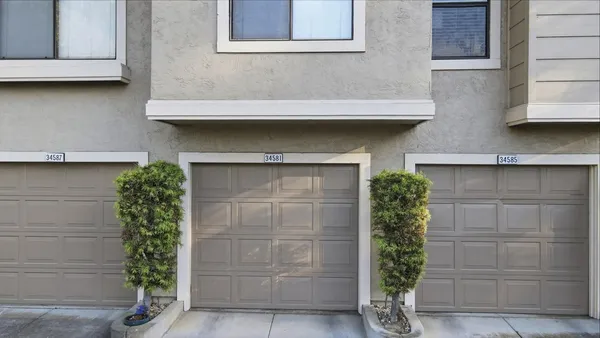 a front view of a house with a garage