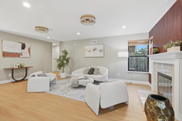 a living room with furniture a couch and a fireplace
