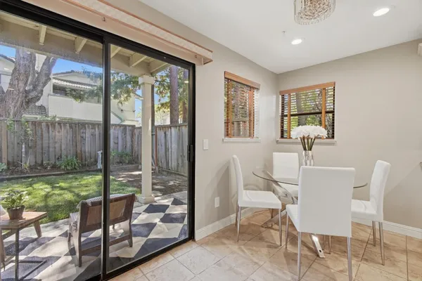 a view of a dining room with furniture window and outside view