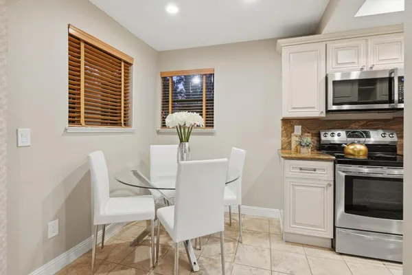 a kitchen with a stove and a microwave