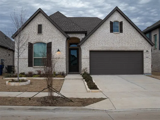 a front view of a house with garage