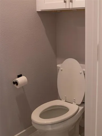 a bathroom with a toilet and a sink