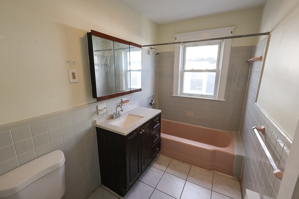 144 Blake Street, Unit 2 Boston, MA 02136 - Photo 16 of 28 a bathroom with a sink toilet and shower