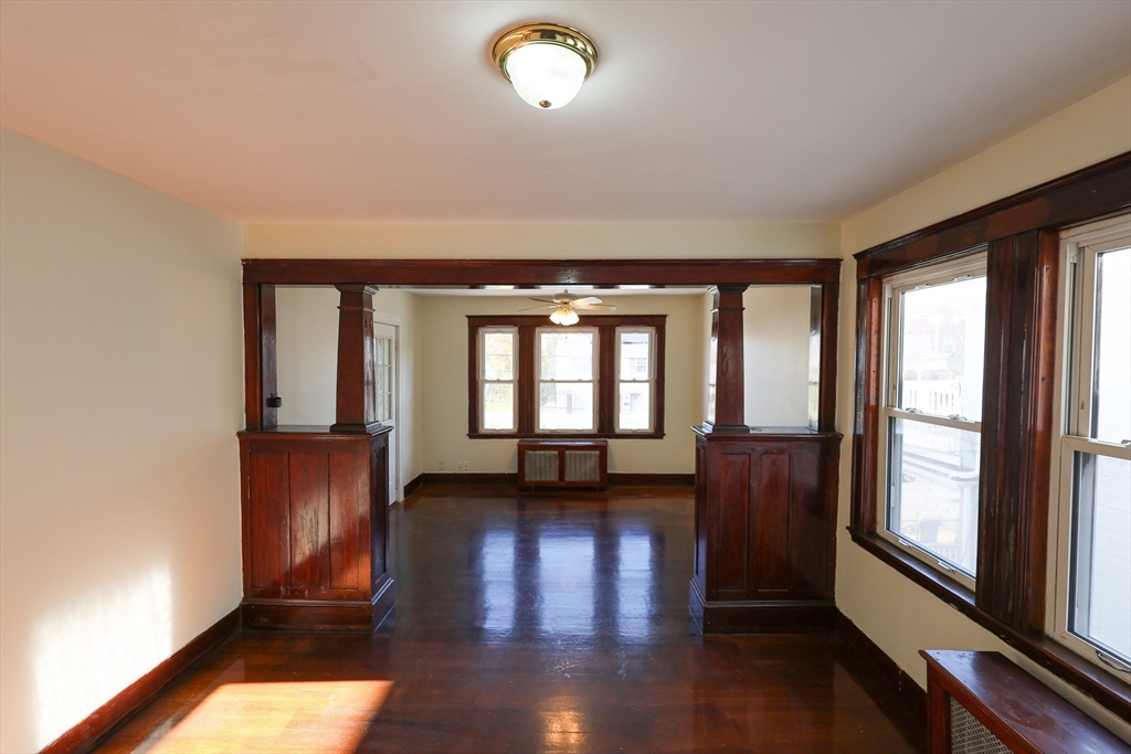 144 Blake Street, Unit 2 Boston, MA 02136 - Photo 8 of 28 wooden floor in an empty room with a window