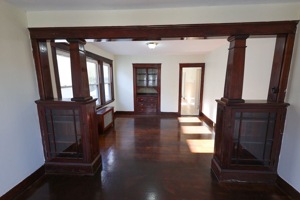 144 Blake Street, Unit 2 Boston, MA 02136 - Photo 9 of 28 a view of hallway with stairs and wooden floor