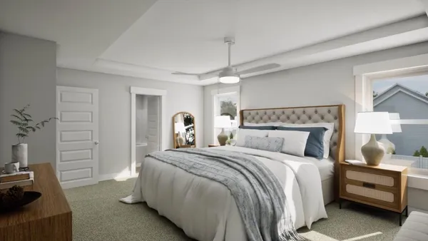 a bedroom with a bed and a couch