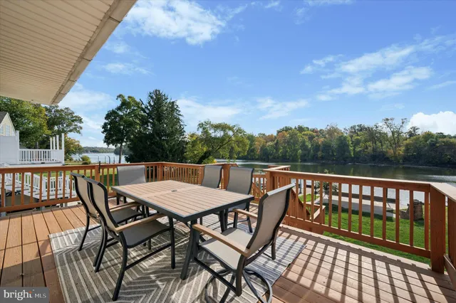 a view of a chairs and table on the deck