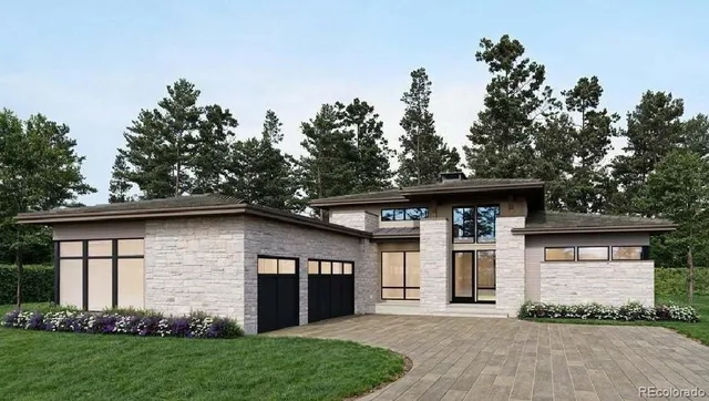 a front view of a house with a garden and trees