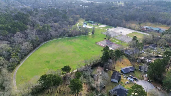 a view of a swimming pool with a yard