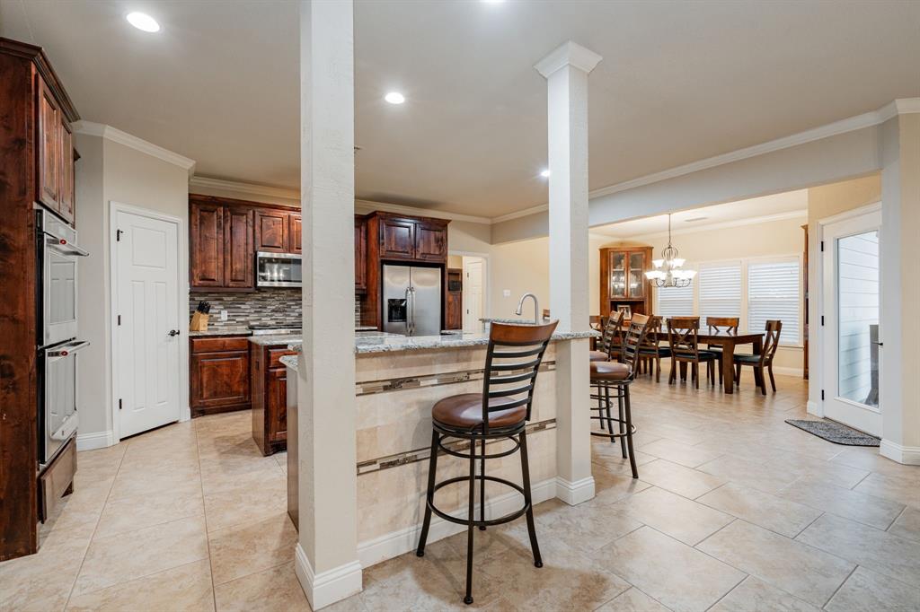 2687 McClendon Road Weatherford, TX 76088 - Photo 10 of 40 a view of kitchen with furniture and large window