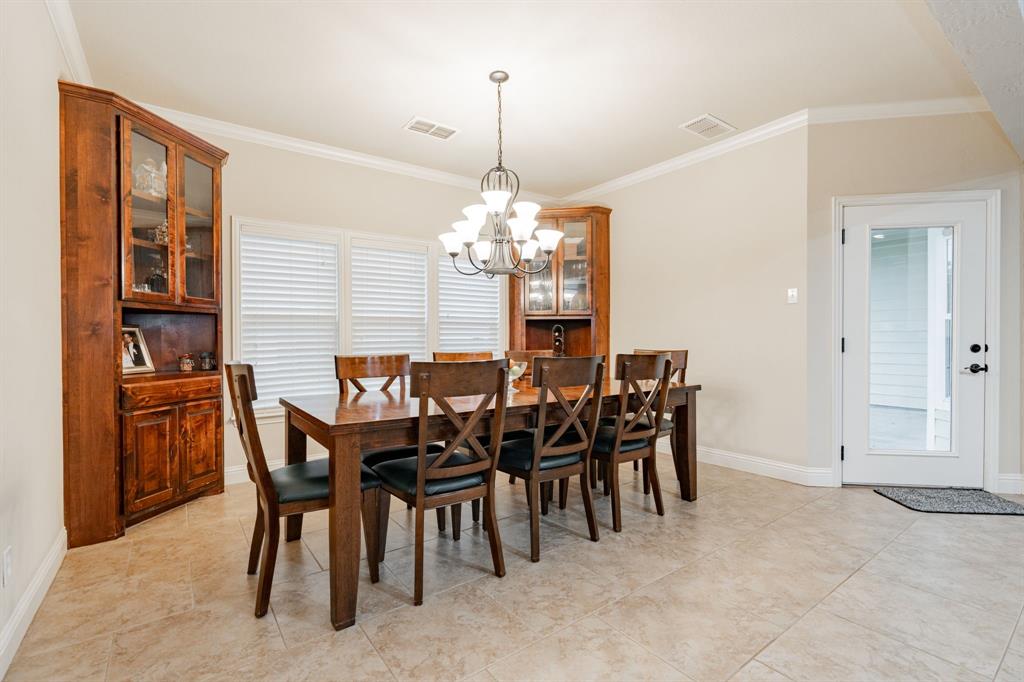 2687 McClendon Road Weatherford, TX 76088 - Photo 16 of 40 a dining room with furniture and window