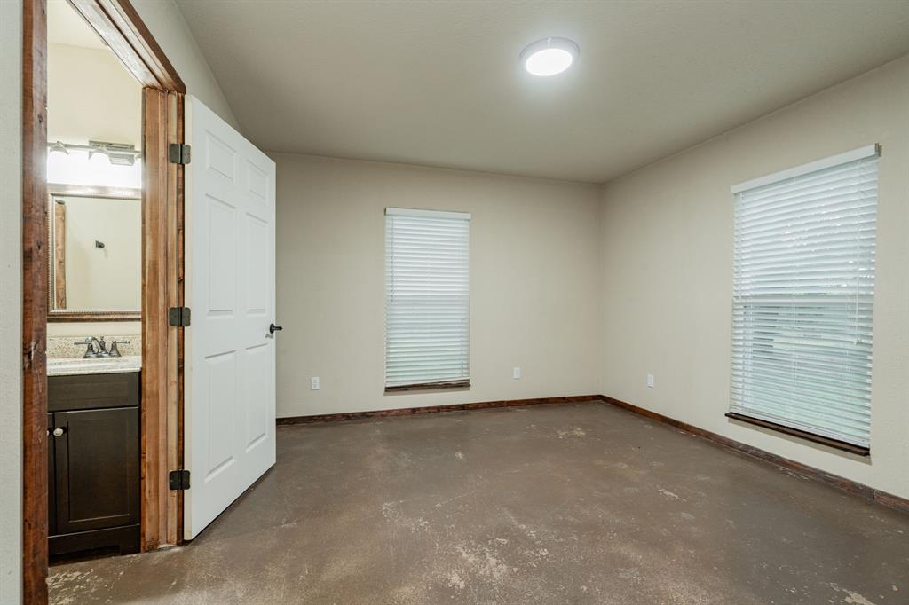 2687 McClendon Road Weatherford, TX 76088 - Photo 38 of 40 an empty room with windows