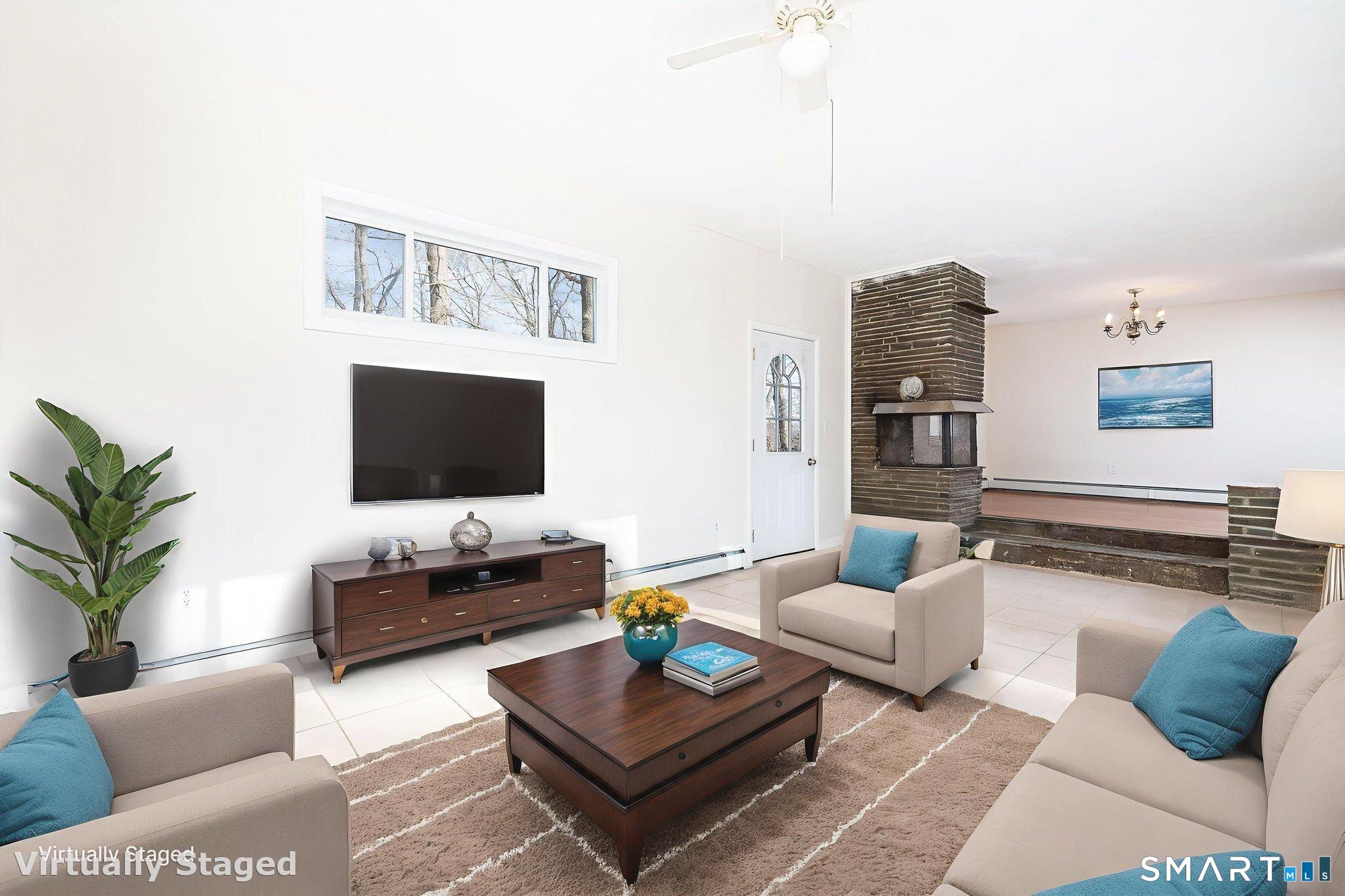 461 Pond Road Franklin, CT 06254 - Photo 3 of 35 a living room with furniture and a flat screen tv