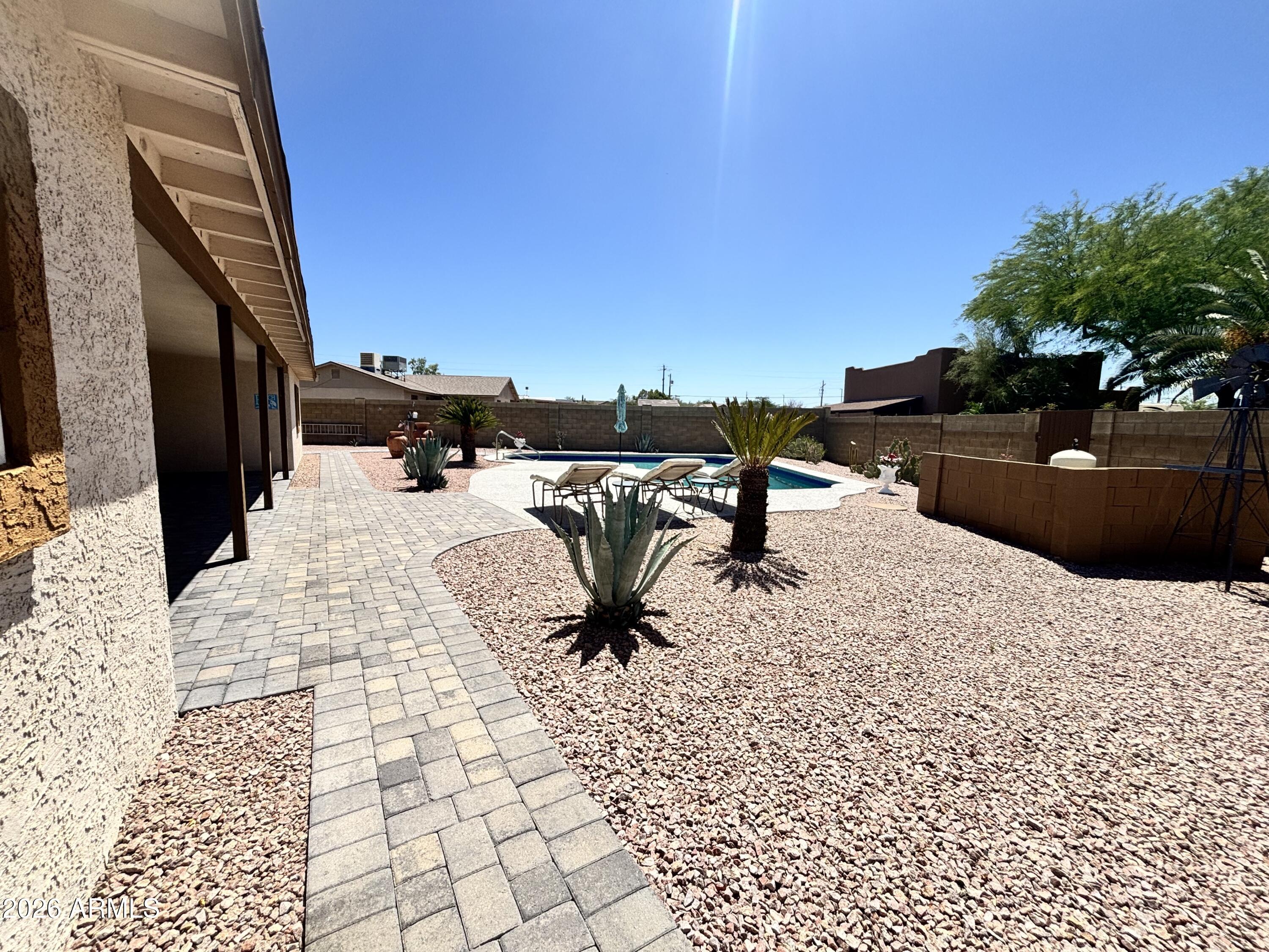 7745 East Mangun Road Mesa, AZ 85207 - Photo 15 of 35 a view of a terrace with chairs