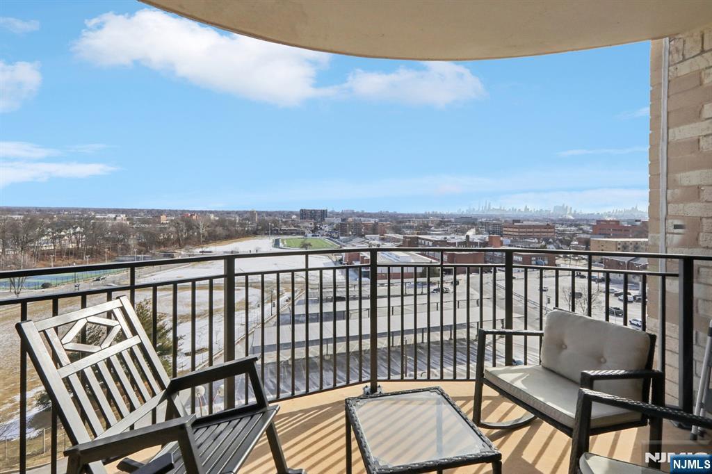 150 Overlook Avenue, Unit 7F Hackensack, NJ 07601 - Photo 19 of 24 a view of a balcony with wooden chairs