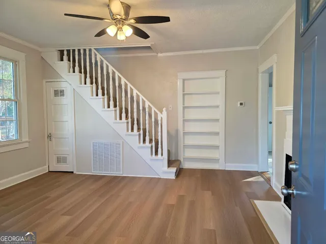 a view of a hallway view with staircase