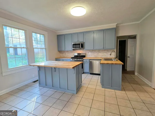 a kitchen with a cabinets and window