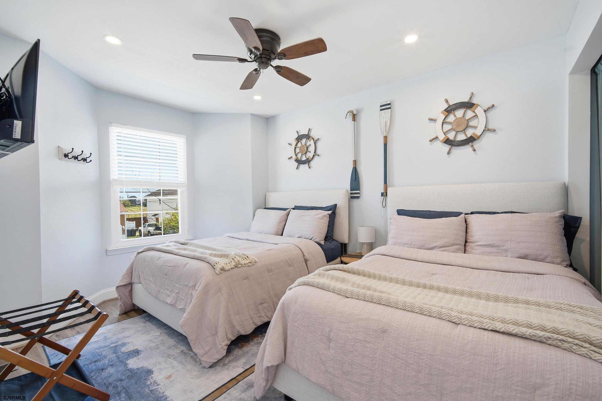 214 Hagen Road Brigantine, NJ 08203 - Photo 16 of 34 a bedroom with two separate beds and a window