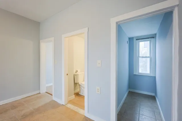a bathroom with a tub a sink and a shower
