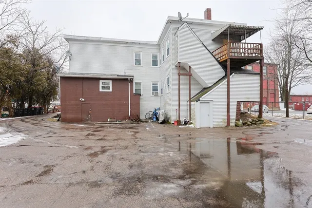 a view of open space with a snow in the yard