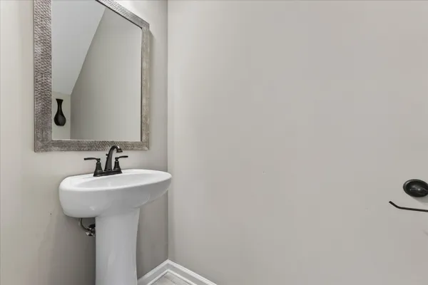 a bathroom with a granite countertop sink mirror and double