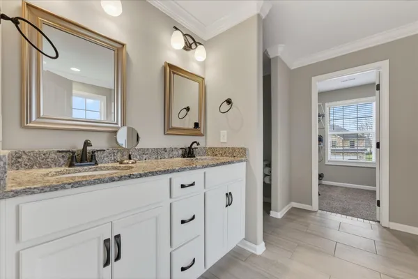 a bathroom with a bathtub and window