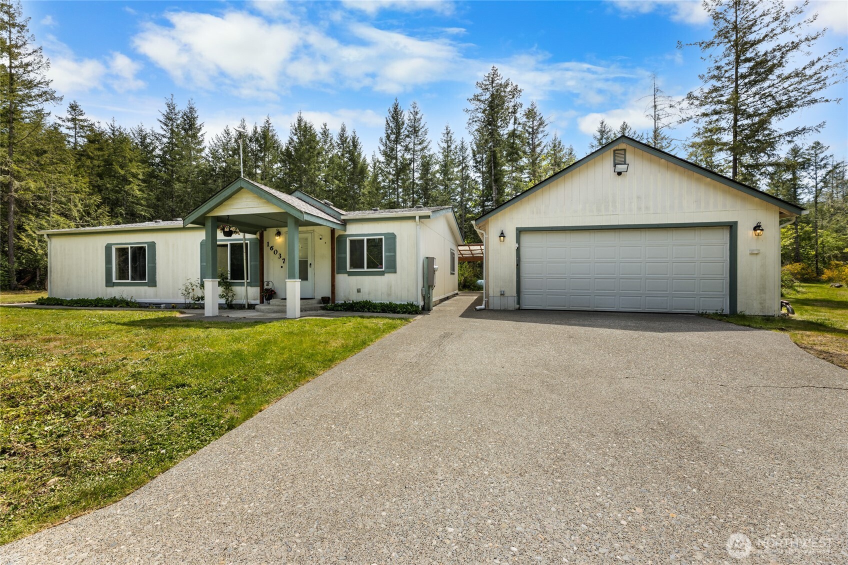 16037 Vail Loop Road Southeast Rainier, WA 98576 - Photo 1 of 32 a front view of house with yard and green space