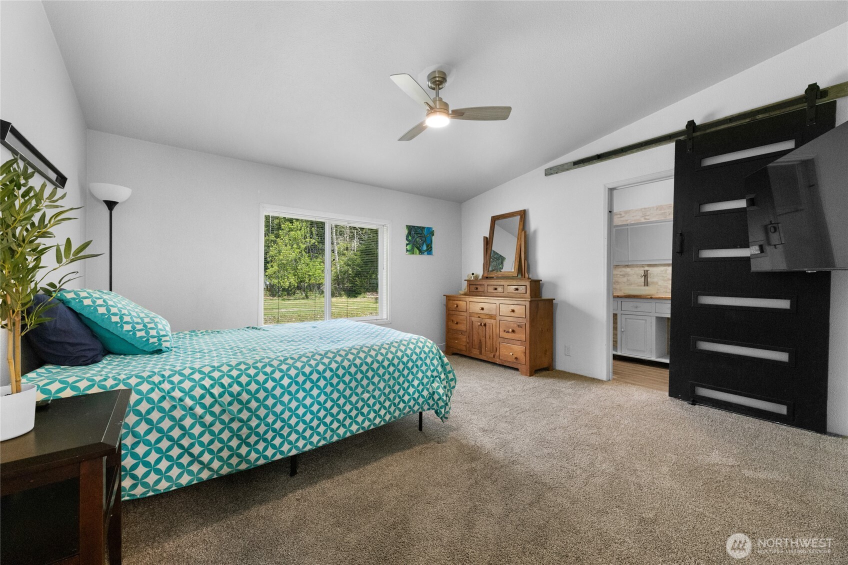 16037 Vail Loop Road Southeast Rainier, WA 98576 - Photo 11 of 32 a bed room with a bed and a window