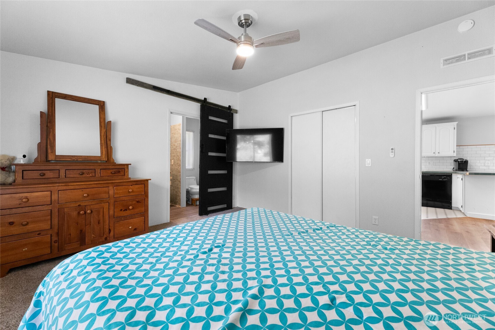 16037 Vail Loop Road Southeast Rainier, WA 98576 - Photo 12 of 32 a bedroom with a bed and a dresser