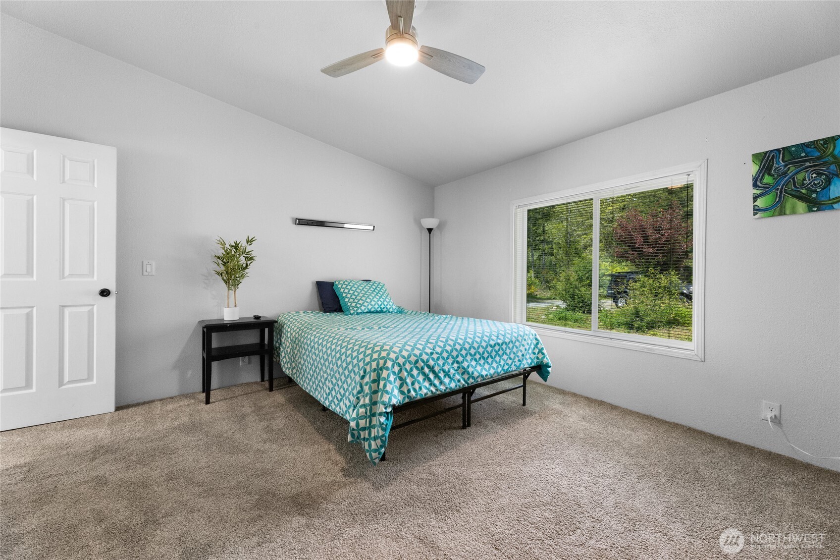 16037 Vail Loop Road Southeast Rainier, WA 98576 - Photo 13 of 32 a bedroom with a bed and a window