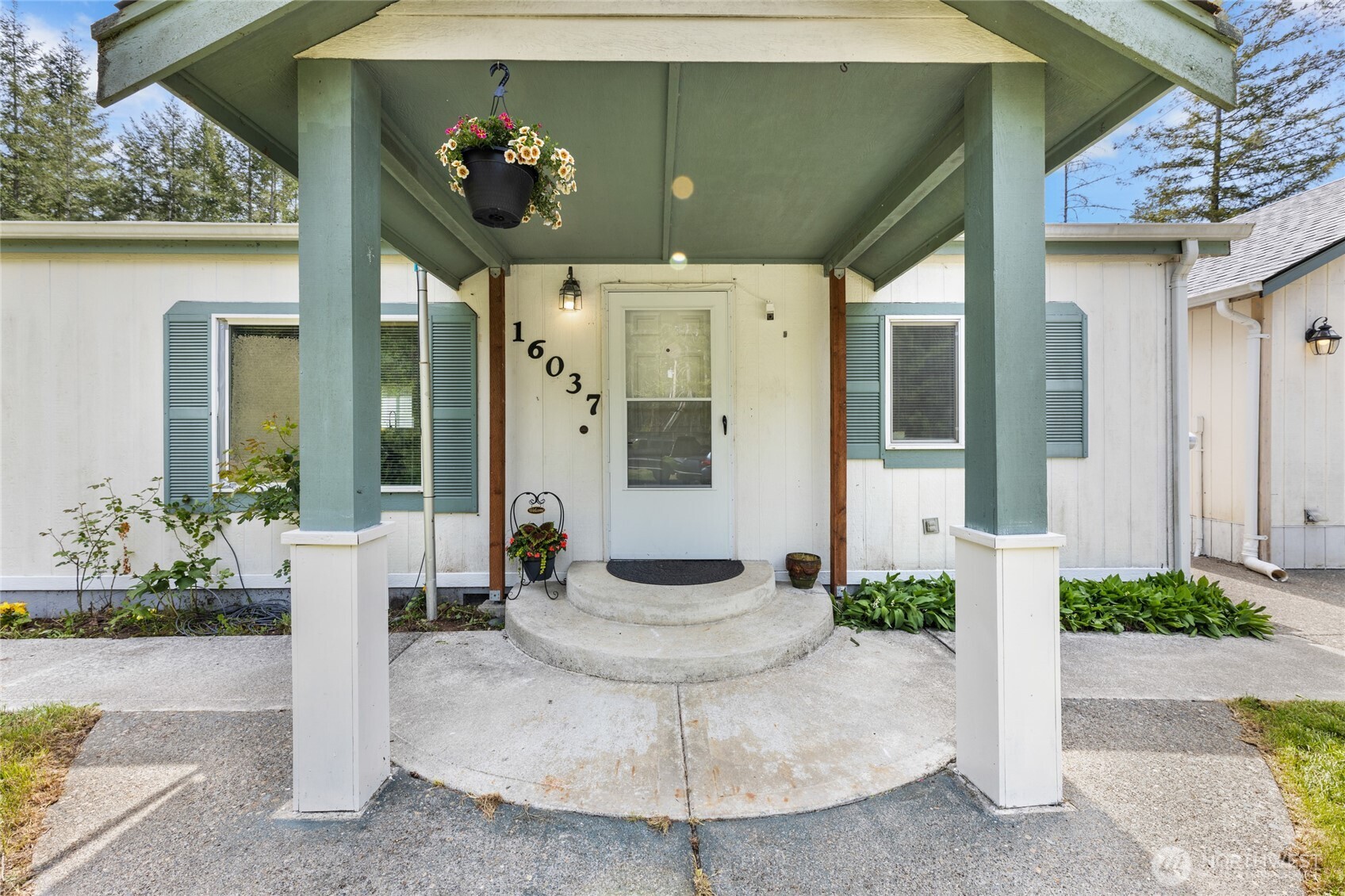 16037 Vail Loop Road Southeast Rainier, WA 98576 - Photo 2 of 32 a view of a patio with table and chairs potted plants