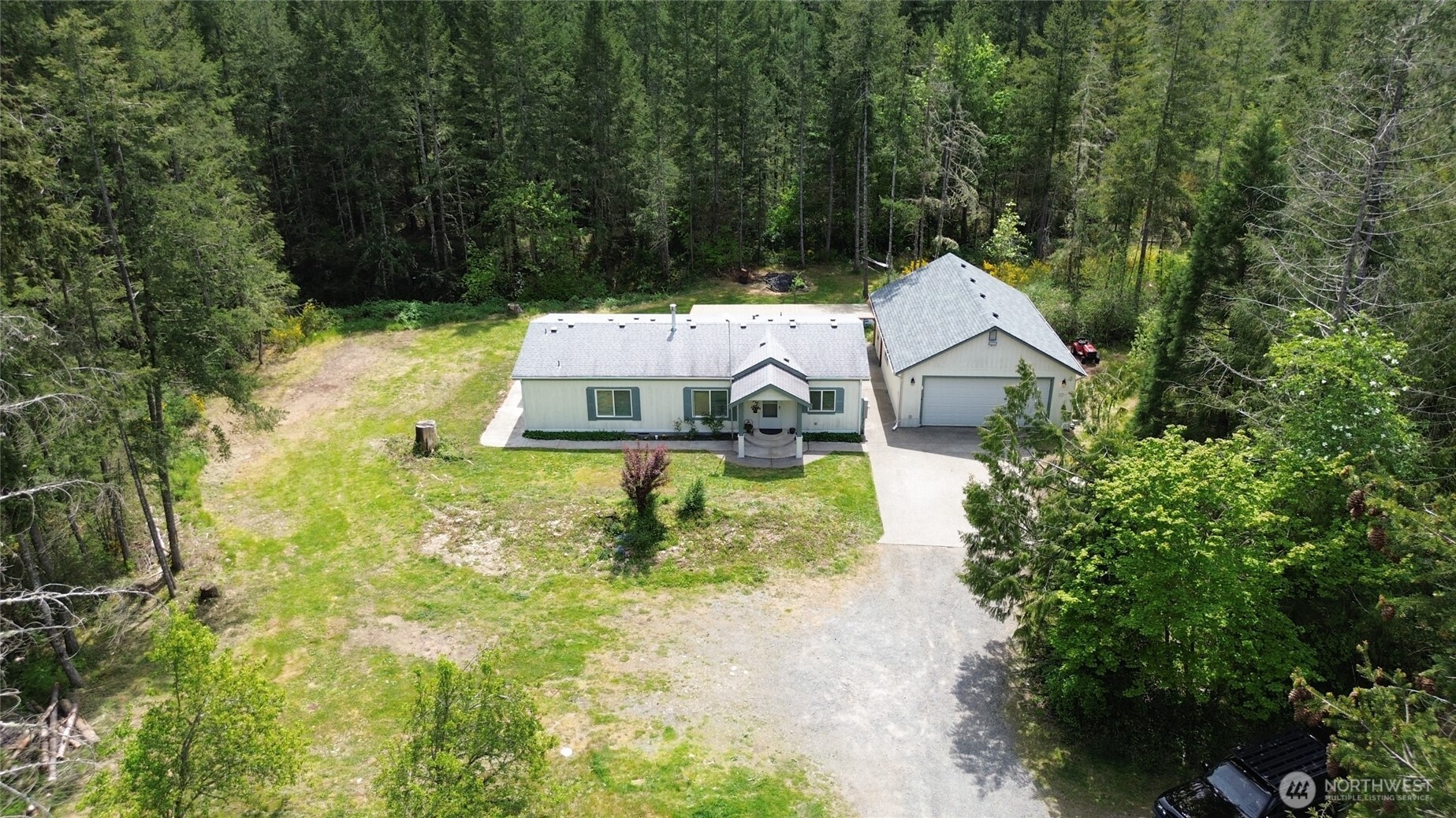 16037 Vail Loop Road Southeast Rainier, WA 98576 - Photo 23 of 32 a view of a house with a yard