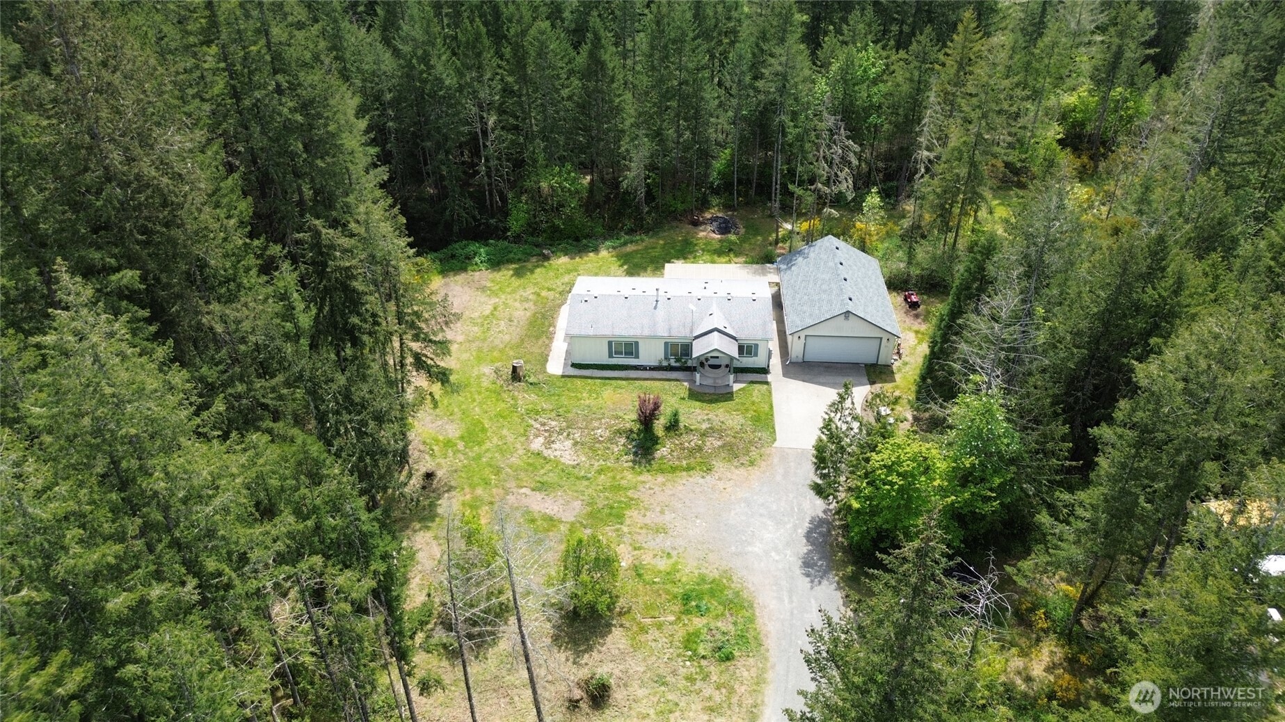 16037 Vail Loop Road Southeast Rainier, WA 98576 - Photo 24 of 32 an aerial view of a house with yard swimming pool and green space