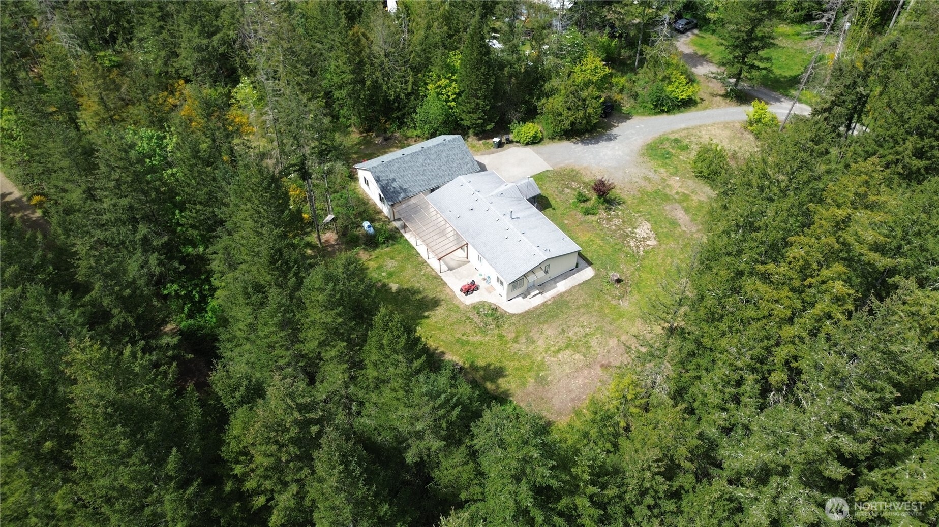 16037 Vail Loop Road Southeast Rainier, WA 98576 - Photo 25 of 32 an aerial view of a house with a yard