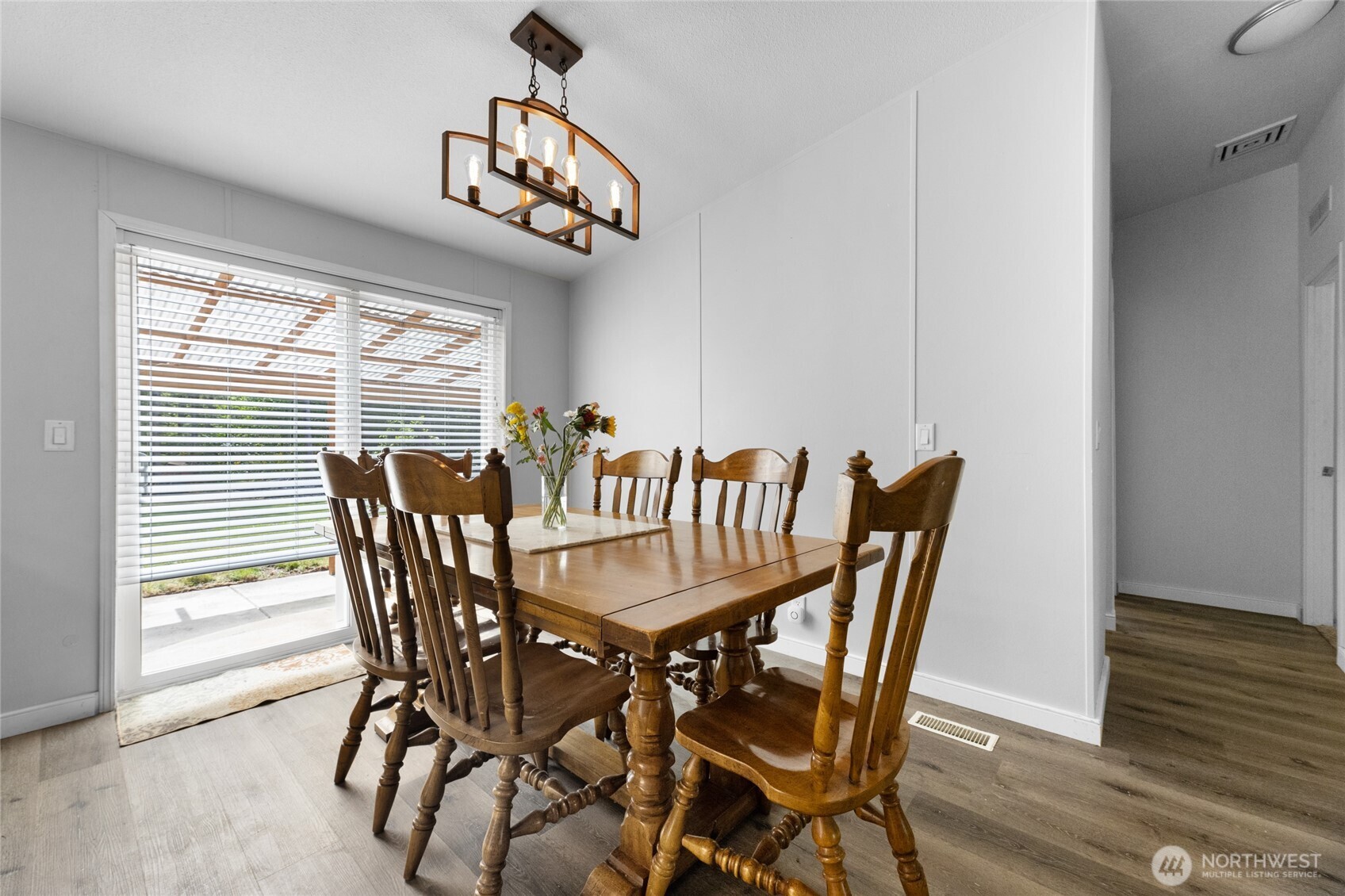16037 Vail Loop Road Southeast Rainier, WA 98576 - Photo 9 of 32 a view of a dining room with furniture window and wooden floor